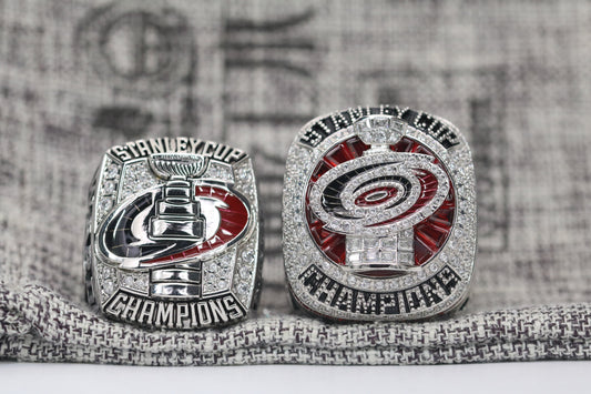 GameDayRings Carolina Hurricanes 2006 and 2026 championship fan rings displayed together